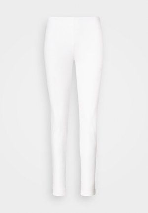 Bele legice iz raztegljivega materiala. Prilegajoča zasnova z gladko teksturo, ki se na gležnjih zoži brez vidnih zapiralk ali okraskov.