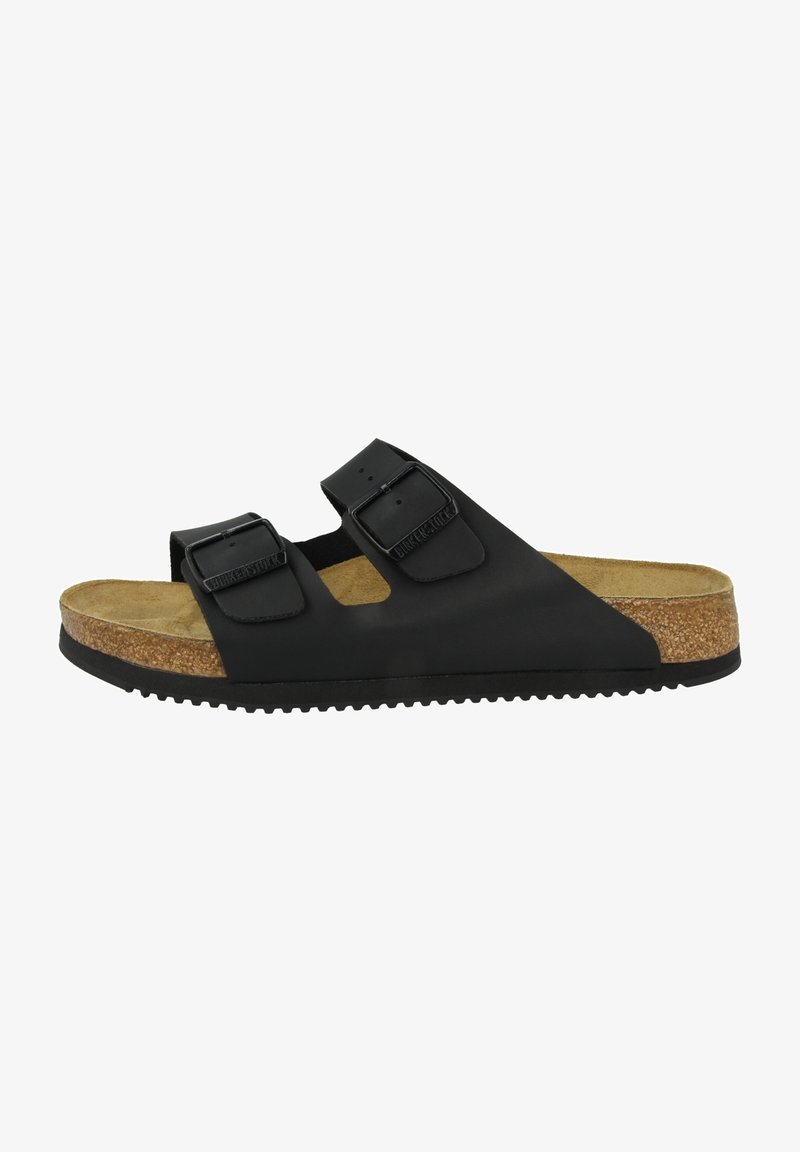 Black slide sandal featuring two adjustable straps with metal buckles, a cushioned cork footbed, and a textured rubber outsole.