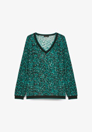 Pulover verde cu decolteu în V, cu un model în zigzag în accente negre și albe. Are mâneci lungi și un tiv ribanat solid negru la hem și manșete.