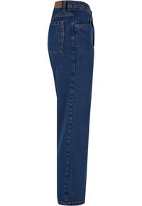 Jeans en denim bleu foncé à coupe droite, vus de côté avec une poche arrière et des détails de couture visibles.