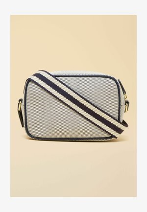 Rectangular navy and white textured crossbody bag with a wide navy and white striped adjustable shoulder strap and gold-tone hardware.