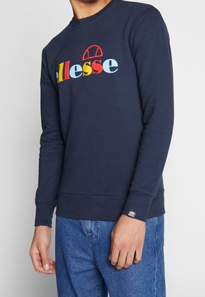 Sudadera azul marino con el colorido logo de "ellesse". Presenta cuello redondo, puños y dobladillo acanalados. Textura de tela suave, ajuste relajado.