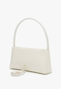 Cream-colored rectangular handbag with a curved handle and detachable matching strap, displayed against a white background.