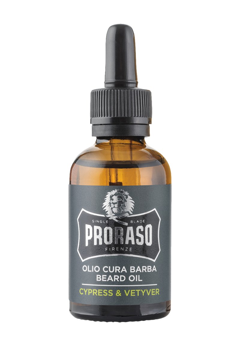 Ambra glasflaska med svart droppkork, med en grå etikett med vit och grön text. Produkten är Proraso skäggolja.