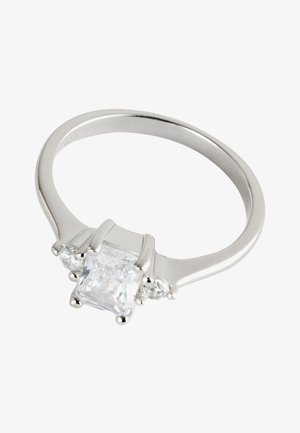 Silver ring with a large square-cut clear gemstone flanked by two smaller round clear gemstones on each side.