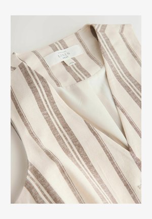 Bézs és barna csíkos vászon mellény ujjatlan kialakítással és V-nyakkal, belső bélés és ruhacímke látható.