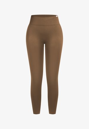 Leggings marron sans coutures à taille haute avec une large ceinture côtelée, longueur cheville, et une petite étiquette blanche de marque en haut à droite.