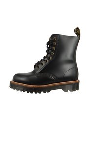 Czarne skórzane buty na sznurówki z okrągłym noskiem, teksturowaną powierzchnią oraz gumową podeszwą z głębokim bieżnikiem i beżowym akcentem w środkowej części.