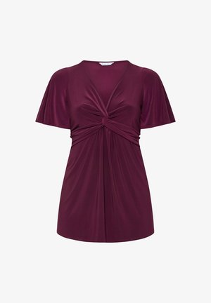 Blommefarvet kortærmet top med V-hals og snoet knudedetalje ved brystet, lavet af blødt, flydende stof.