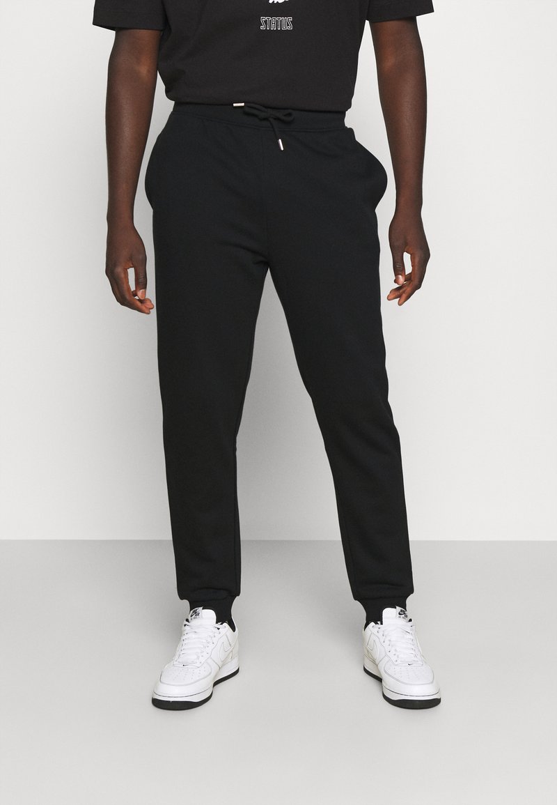 RETHINK Status JOGGER UNISEX Tracksuit Bottoms Black Zalando ie
