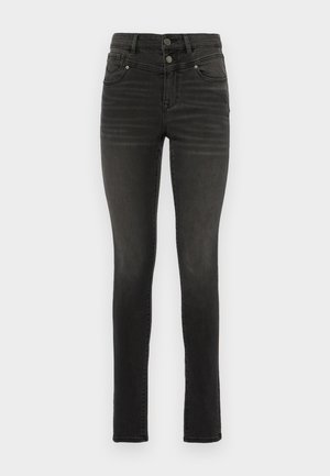 Svarta smala jeans i denim med hög midja, med dubbla knappar, fem fickor och subtila blekningar längs benen.