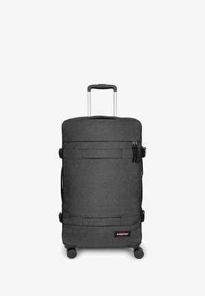 Zwarte stoffen koffer met twee geruisloze wielen, telescopische handgreep, voorvak en Eastpak-logo. Glad oppervlak en rechthoekige vorm.