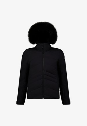 Zwarte pufferjack met een hoge kraag en afneembare, met bont gevoerde capuchon. Voorzien van een rits aan de voorkant en een chevron-quiltontwerp. Lange mouwen en verstelbare manchetten.