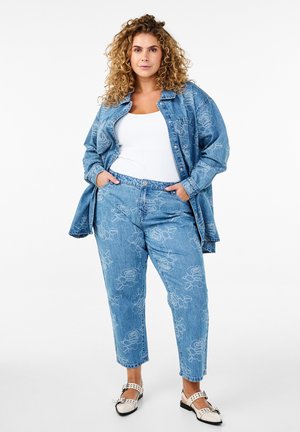 Light blue denim outfit featuring floral embroidery; oversized shirt with button closure and relaxed-fit jeans with tapered leg.