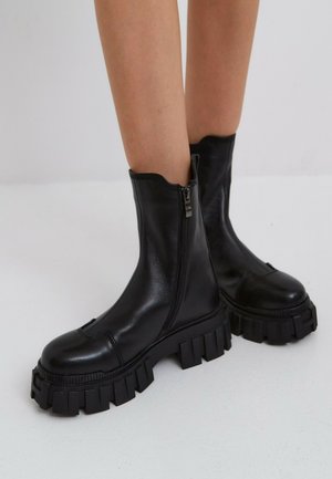 CHUNKY - Platform ankle boots - black