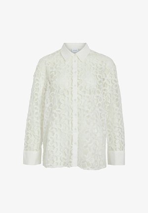 White shirt featuring floral embroidery, button-up front, pointed collar, and long sleeves with contrasting cuffs. Textured fabric design.