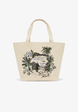 Borsa a tracolla in tela con un'illustrazione marina che mostra una persona accanto a una balaustra, palme, una barca a vela e la firma "Karl".