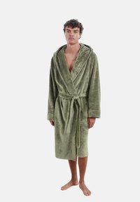Olive green plush bathrobe with a hood, tie belt, two front pockets, and soft, textured fabric, reaching mid-calf length.