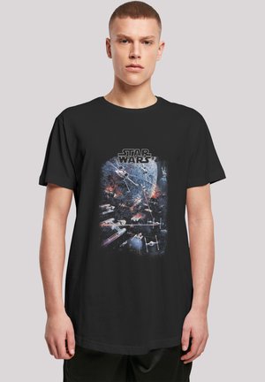 Black cotton t-shirt featuring a "Star Wars" graphic print, depicting starships against a starry background. Short sleeves, relaxed fit.