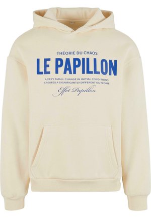 Cream hoodie with a front pocket. Features blue text on the chest: "THÉORIE DU CHAOS LE PAPILLON" and a detailed quote below.