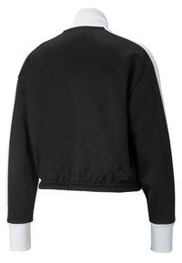 Fekete rövidített dzseki magas gallérral és fehér kiegészítőkkel. Simább anyag, elasztikus derék és mandzsetta, minimalista design.