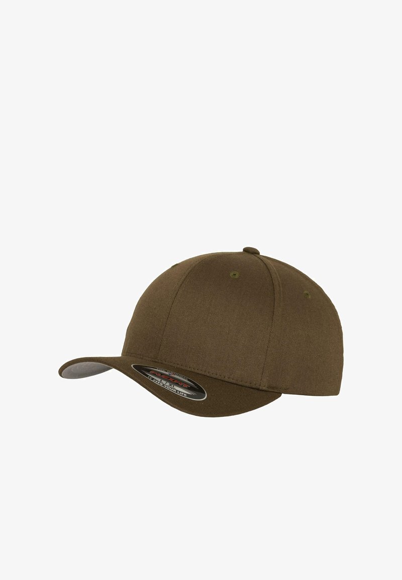 Brown baseball cap with a curved visor, made of fabric with a textured finish. Features ventilation holes and a label on the visor.