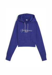 Fialový skrátený mikina vyrobená z mäkkej tkaniny, s klokánkovou kapsou, šnúrkami a bielym logom "Sportswear by PUMA" na prednej strane.