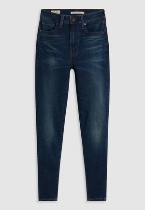 Donkerblauwe denim jeans met een skinny fit, voorzien van vijf zakken, subtiele vervaging en contrasterende stiksels. Hoge taille met een rits.