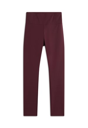Leggings bordeaux con un alto girovita, realizzati in un tessuto liscio ed elastico. Senza motivi o dettagli; design semplice e slim fit.