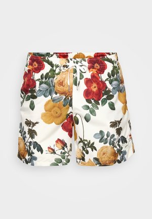 Pantaloni da bagno floreali con uno sfondo bianco decorato da fiori rossi, gialli e arancioni, e foglie verdi. Inclusi un girovita regolabile con cordoncino.