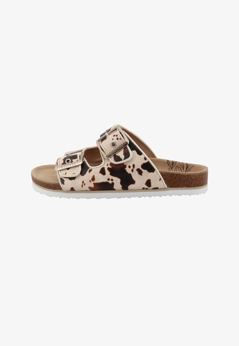 Sandales à glissière marron et beige avec motif de vache, deux boucles ajustables, semelle intérieure en liège et semelle extérieure en caoutchouc blanc.