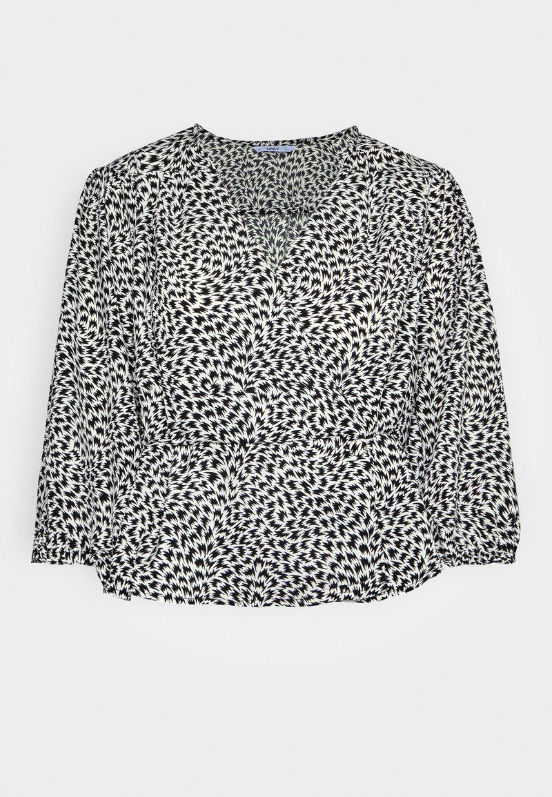 Blusa estampada em preto e branco com decote em V, mangas longas e punhos franzidos. O tecido apresenta desenhos geométricos em espiral.