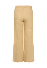 Pantalons larges beige clair en coton, dotés d'une taille mi-haute, de deux poches arrière et d'une texture lisse sans accessoires visibles.
