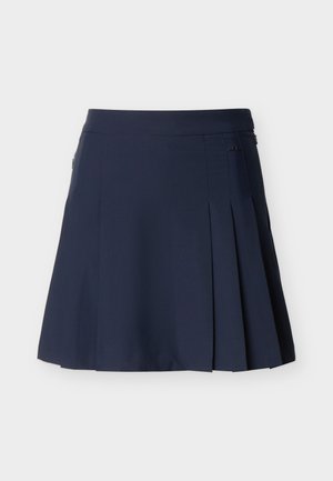 Φούστα σε σκούρο μπλε ναυτικό με πλισέ, εφαρμοστός ζωνάκι στη μέση και κλείσιμο με φερμουάρ στο πλάι, εμφανίζεται σε απλό ανοιχτό φόντο.