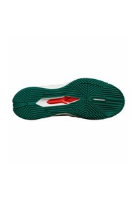 Schuhsohle mit einem strukturierten grünen Gummidesign und einem zentralen roten Akzent; verfügt über geometrische Muster für Traktion und Langlebigkeit.