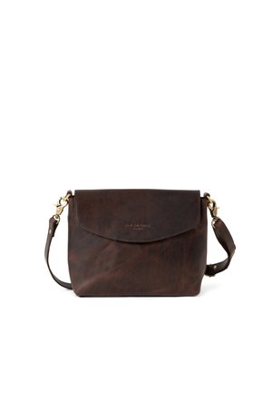 Brown leather crossbody bag with a curved flap, gold hardware accents, adjustable strap, and a smooth, textured finish.