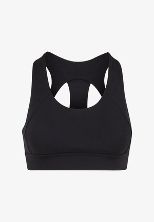 Soutien-gorge de sport noir avec une texture douce, design dos nageur et détails découpés à l'arrière. Fabriqué en tissu extensible pour plus de confort.