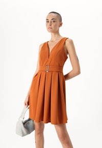 WAL G PETITE DEBBIE BUCKLE SKATER DRESS - Jerseykjole - dusty orange