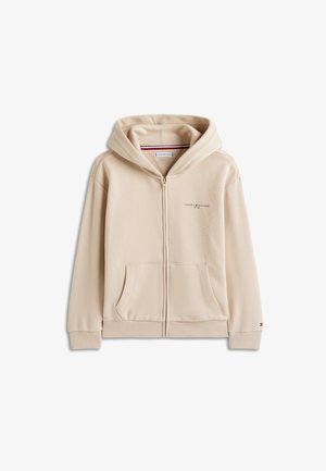 Bež majica s kapuljačom na patentni zatvarač s prednjim džepovima i kapuljačom, s malim logotipom Tommy Hilfiger na prsima i manžetni.