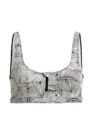 Soutien-gorge noir et blanc à motif de feuilles, avec des bretelles larges, un décolleté carré et une fermeture éclair à l'avant. Confectionné en tissu extensible à texture lisse.