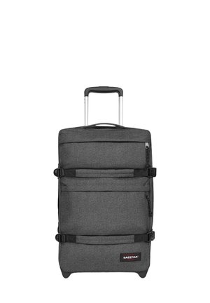 Donkergrijze zachte stoffen koffer met telescopische handgreep, twee compressiebanden, voorvakken met rits en Eastpak-logo onderaan.