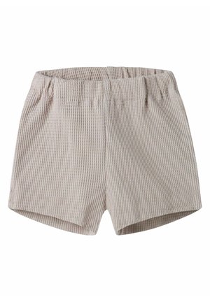Beżowe krótkie spodenki z elastyczną talią i fakturą waflową, o prostym kroju, bez widocznych kieszeni i zdobień.