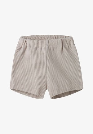 Short beige à taille élastique avec texture gaufrée, coupe droite, sans poches ni ornements visibles.