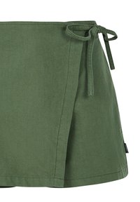 Groene katoenen wikkelrok met striksluiting, rechte snit, eenvoudige zoom en subtiele textuur. Bevat een label aan de onderste zoom.