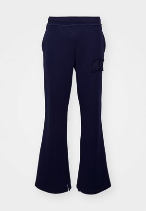 Mørkeblå sweatpants lavet af blødt stof; flared design med elastisk talje og broderet "MH" logo på venstre side foran.