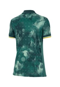 Polo verde con un motivo testurizzato che presenta design astratti, punti e forme geometriche. Accentuato da strisce gialle sulle maniche.