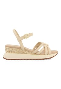 Beige wedge sandal with woven jute heel, adjustable ankle strap, and multiple crossed straps. Rubber sole with textured grip.