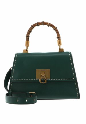Sac à main en cuir vert foncé avec fermoir doré et poignée supérieure de style bambou, bandoulière détachable et détails de couture blanche.