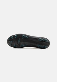 Black soccer cleat sole with patterned texture, featuring teal studs for traction and curved design for performance enhancement.