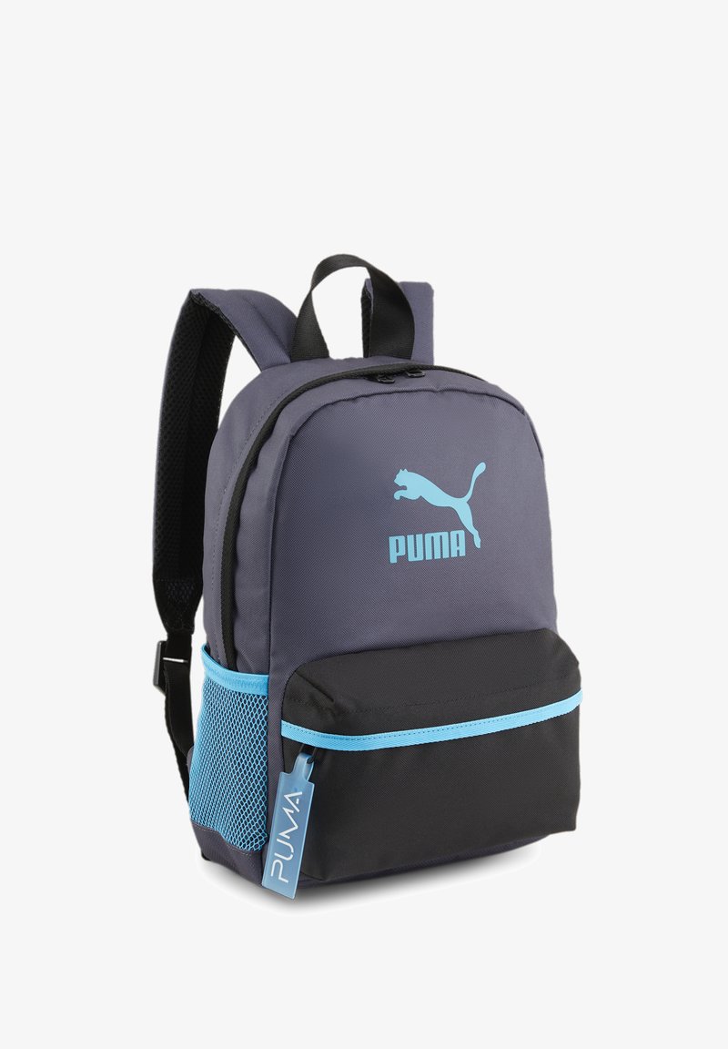 Puma backpack in dark gray and black, featuring a blue logo, front pocket, side mesh pocket, and padded adjustable straps.